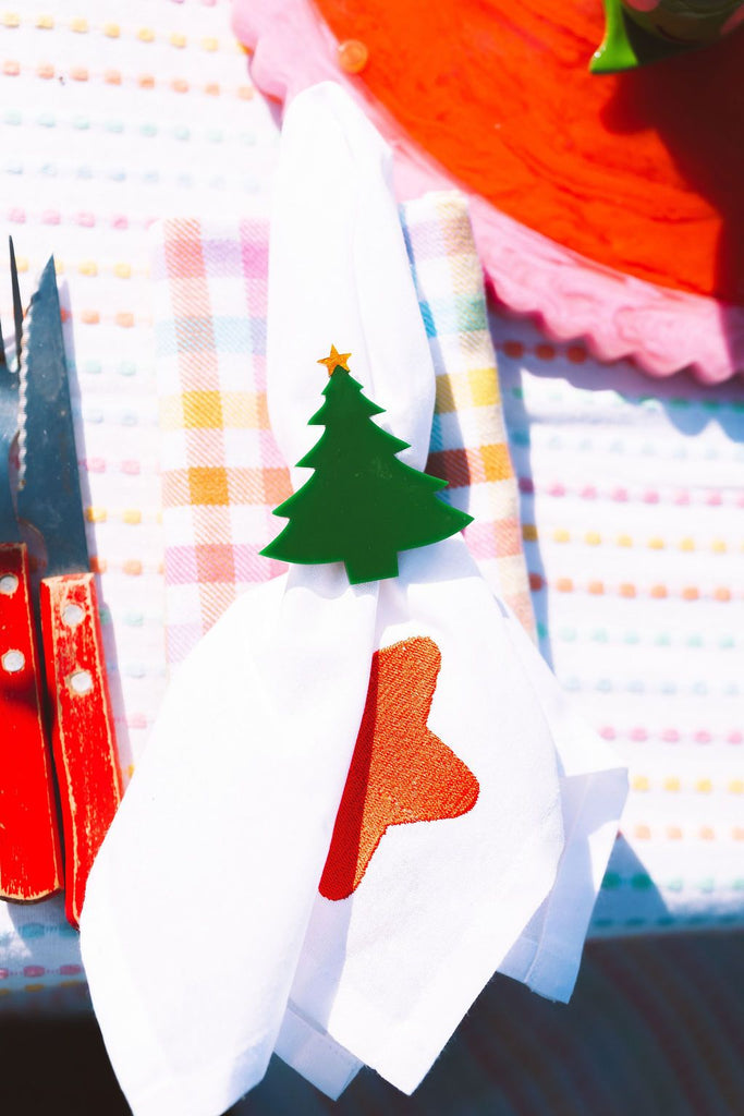 Colorful towel with Christmas tree and stocking design on a checkered background