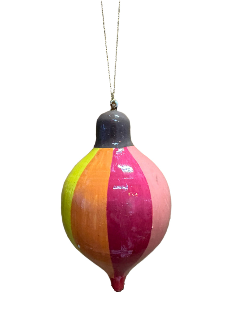 Colorful buoy with a string on a wooden surface