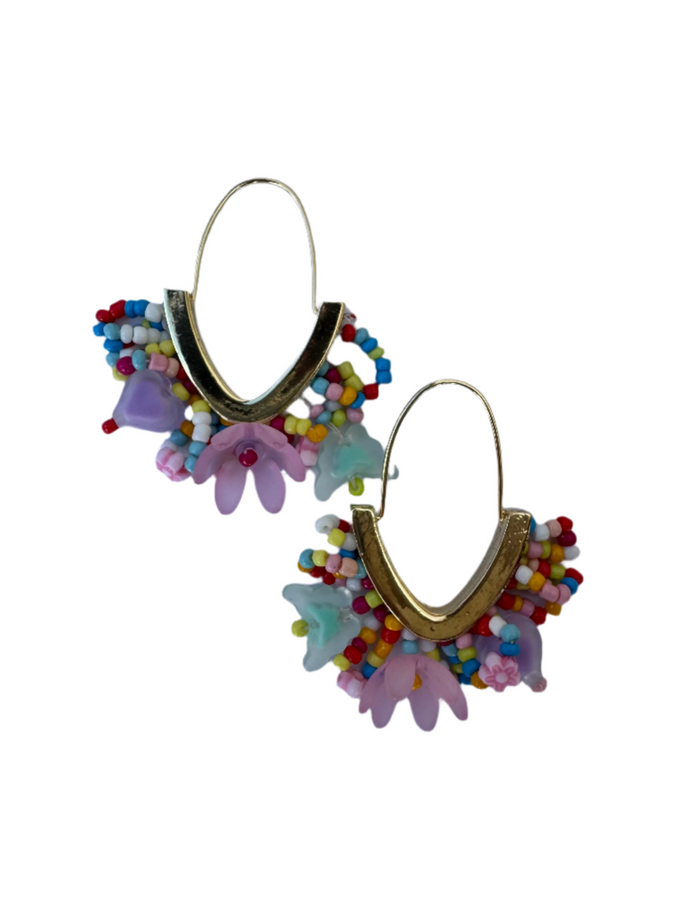 Colorful beaded earrings with floral designs on a white background